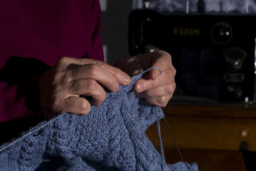 Woman hands knitting closeup