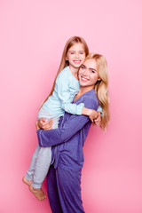 Concept of kindness, happiness and spending time together with a family. Goodnight! Mother and her...