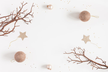 Christmas composition. Christmas balls, beige decorations on white background. Flat lay, top view,...