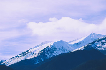 Plakat Mountain snow peak, beautiful natural winter backdrop. Ice top of the hill, blue sky background. Alpine landscape.