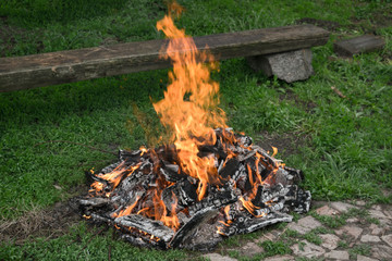 Bonfire on the grass during the day