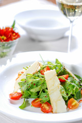 Fresh healthy salad and white wine