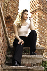 Girl standing on a steps into a Castle in Verona