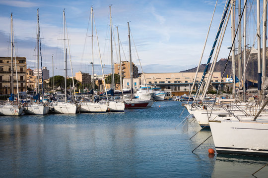 Boats and yachts parked in La Cala bay, old port in Palermo, Sicily, Italy.