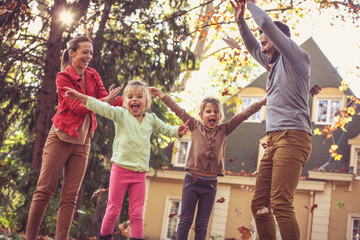 Fototapeta premium Family time, Happy family playing outside, autumn season.