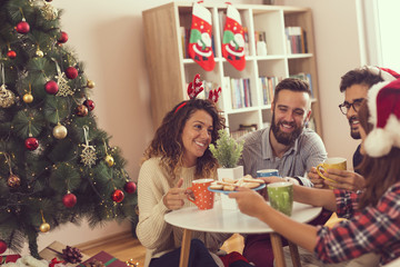 Friends having Christmas morning coffee