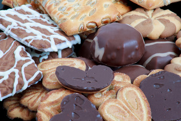 Different kinds of cookies and chocolate marshmallow close up.