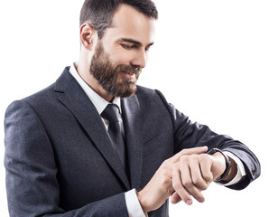 Handsome young businessman using smart watch.