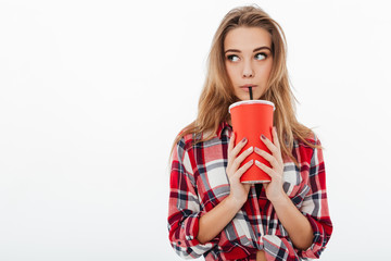 Portrait of a young cute girl in plaid shirt