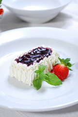 blueberry sweet sauce with cream cake and strawberry
