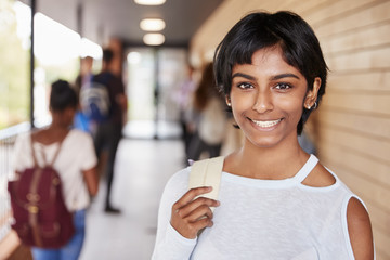 Portrait Of Female Teenage Student On College With Friends