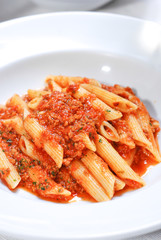 Penne pasta with a beef, pork and tomato