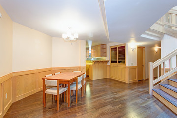 Spacious dining room with wood dining table set