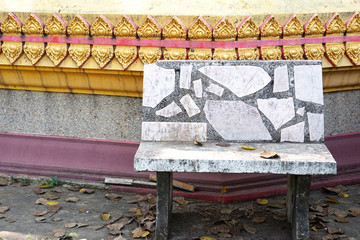 Fototapeta na wymiar Old stone bench in the temple of Thailand