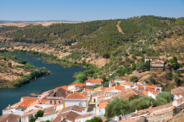 Fototapeta na wymiar View of Guadiana river bend and residential houses of Mertola city on the ripe. Mertola. Portugal