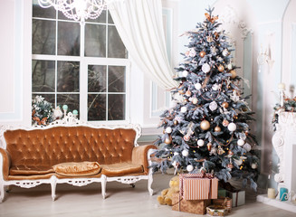 Feast of the Nativity. Beautifully decorated house with a tree and presents at Christmas
