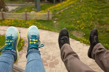 Tourist's shoes above the meadow. Picture taken on a mountain lift