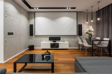 Home interior with projector screen - obrazy, fototapety, plakaty