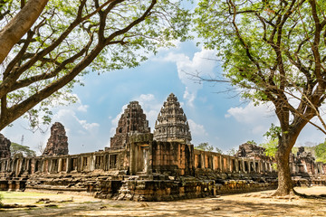 views of corner of ruins and temples of khmer imperium in thailand with stupa towers traditional khmer arquitecture. phimai area.