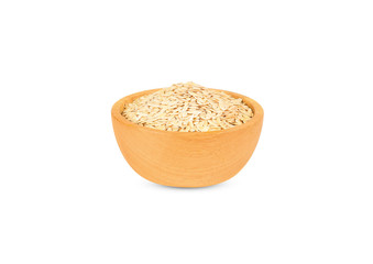 Dry  cucumber seeds in a wooden cup isolated on white background