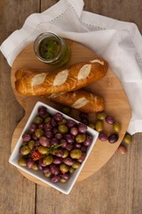 Overhead view of olives with bread