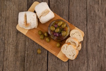Overhead view of olives by bread