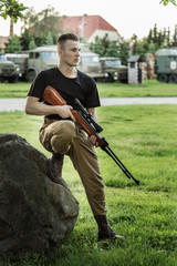 Man and woman in soldier's suit on white background