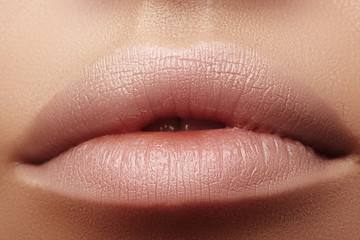 Moisturizing lip balm, lipstick. Close-up of beautiful sexy lips. Full lips with natural lip...
