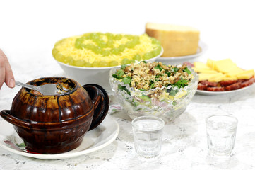 Festive table with a hot dish and salads
