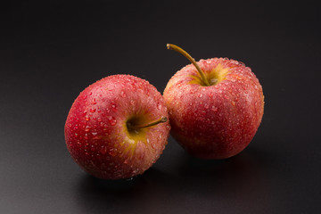 Red apples isolated on a black background