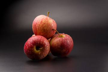 Red apples isolated on a black background