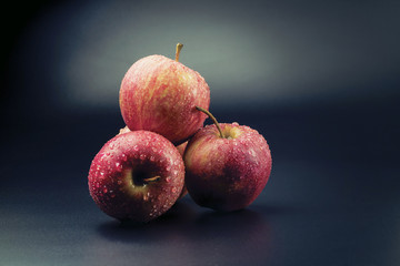 Red apples isolated on a black background