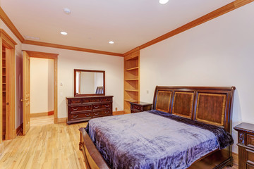 Welcoming mansion bedroom with a light hardwood floor