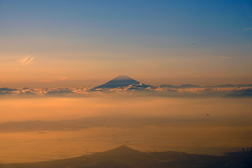 Fototapeta na wymiar Aerial view of Japan's Mount Fuji volcano at sunset in the clouds