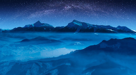 Fototapeta na wymiar Starry sky with milky way above the high mountain ridge