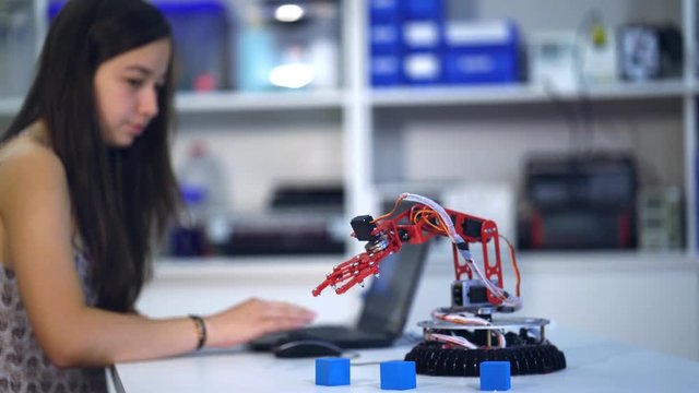 Young woman in robotics laboratory