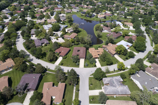 Neighborhood Aerial View With Pond