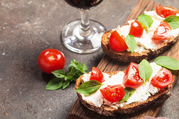 Crostini appetizers with cherry tomatoes