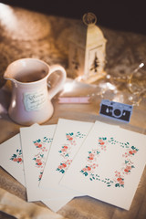 Moody rustic cinnamon colour style Christmas composition with small camera and the bokeh background