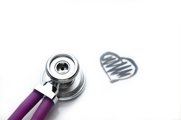 Medical stethoscope on a cardiogram on the desk