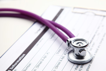 Health insurance form with medical stethoscope concept for life plannin