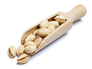 Scoop of Roasted pistachios nuts isolated on white background. Clipping path