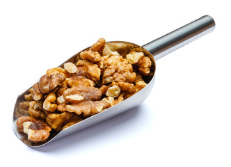 Scoop of Roasted walnuts isolated on white background. Clipping path