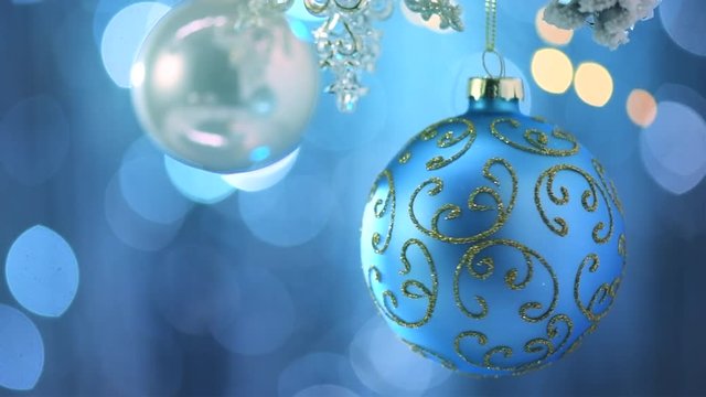 Christmas and New Year blue decoration. Abstract blinking holiday background. Slow motion 4K UHD video footage. 3840X2160