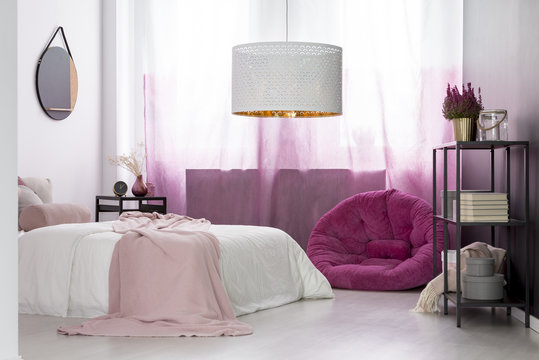 Girl's bedroom with pink pouf
