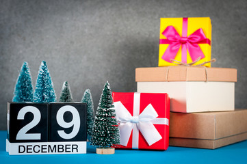December 29th. Image 29 day of december month, calendar at christmas and new year background with gifts and little Christmas tree