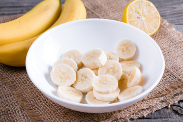 Sliced banana in a white bowl