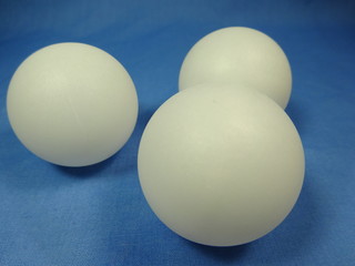 A group of table tennis balls in blue background