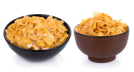 Corn flakes with milk in bowl isolated on white