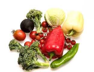Bell peppers with cherry tomatoes and cabbages isolated on white